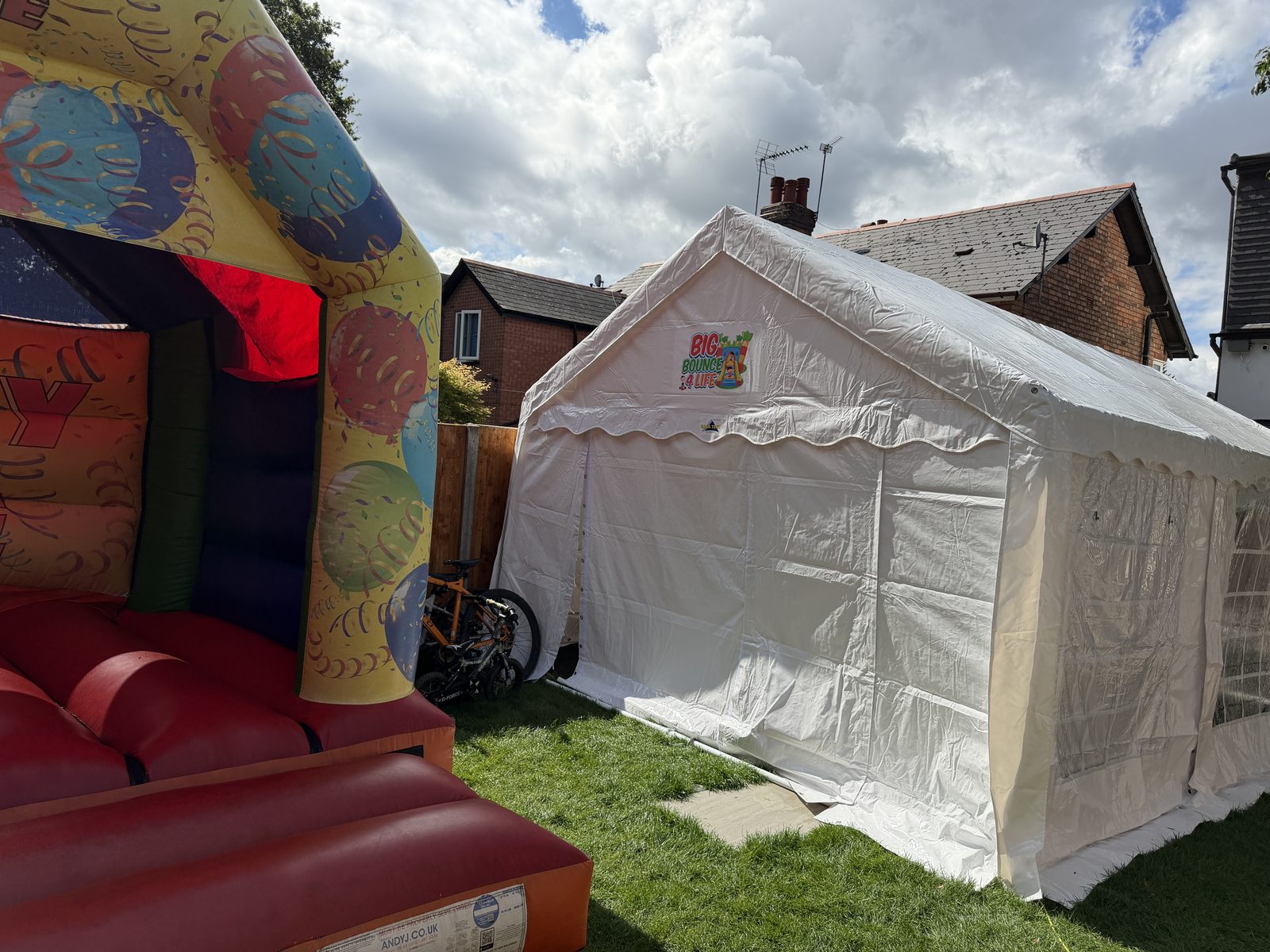 Colourful bouncy castle next to the marquee, the castle package offered in Solihull